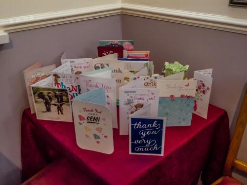 a table with a bunch of books on it at The Tudor Lodge in Skegness