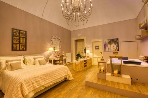 Postel nebo postele na pokoji v ubytování Corte Rossetti Le Dimore Luxury B&B