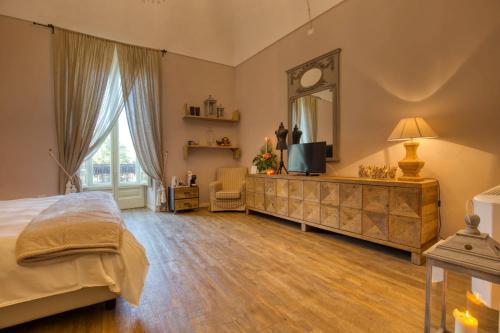 Postel nebo postele na pokoji v ubytování Corte Rossetti Le Dimore Luxury B&B