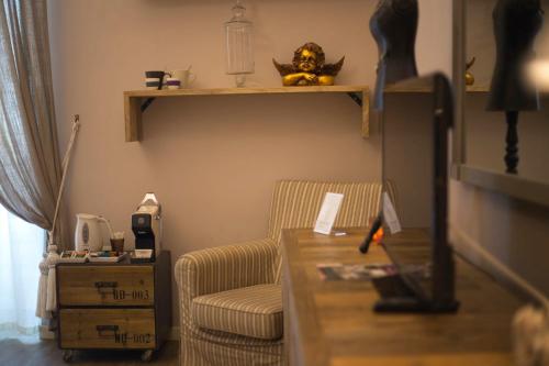 TV a/nebo společenská místnost v ubytování Corte Rossetti Le Dimore Luxury B&B