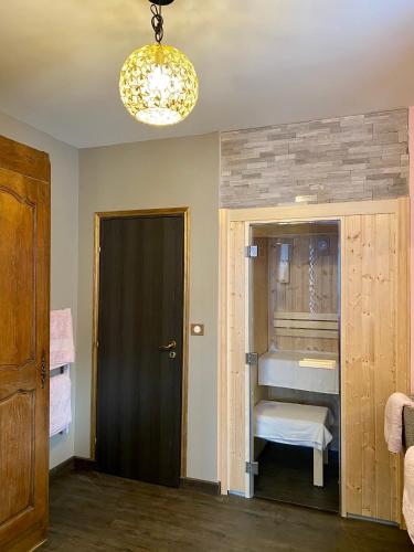 a room with a bathroom with a sink and a mirror at Salon Boyer in Épernay