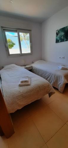 Ένα ή περισσότερα κρεβάτια σε δωμάτιο στο Casa Calida 2 Jardin 11