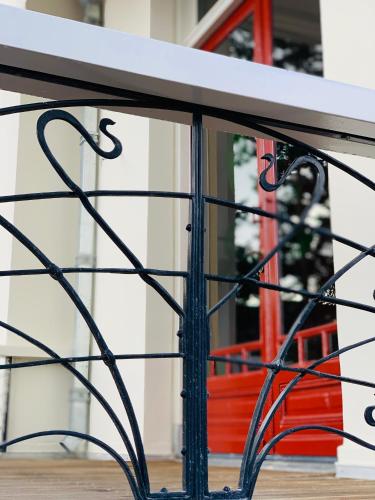 a table with black metal legs and a window at Stella Suites Boutique Hotel in Goirle