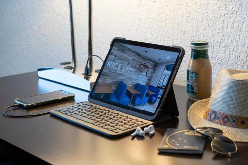 a laptop computer sitting on top of a desk at Hotel Monreale Express International Drive Orlando in Orlando