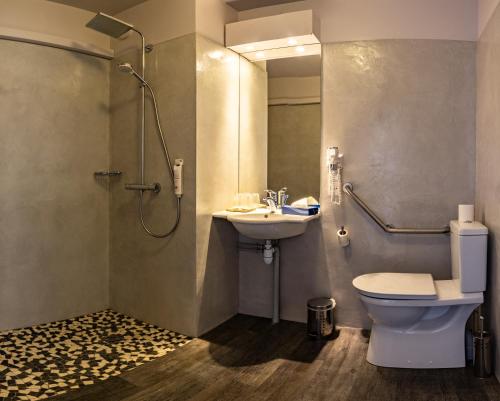 a bathroom with a toilet and a sink and a shower at Hôtel du Golf de l'Ailette, The Originals Relais (Qualys-Hotel) in Chamouille