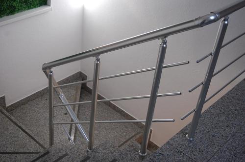 a metal railing on the side of a wall at Pansion Fočin Han in Sarajevo