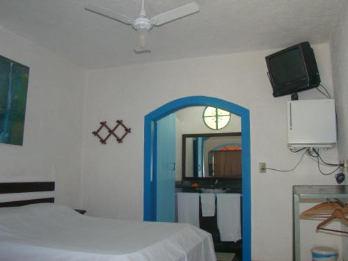Säng eller sängar i ett rum på Pousada do Escultor