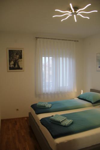 Posteľ alebo postele v izbe v ubytovaní Apartment Zarko