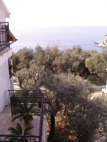 a balcony of a house with a view of the ocean at Guest house Živković in Sveti Stefan