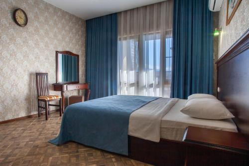 Кровать или кровати в номере Karap Hotel