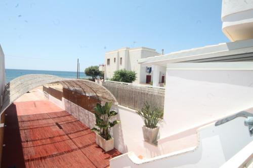 a balcony with a view of the ocean at Villetta Campurè in Pizzo