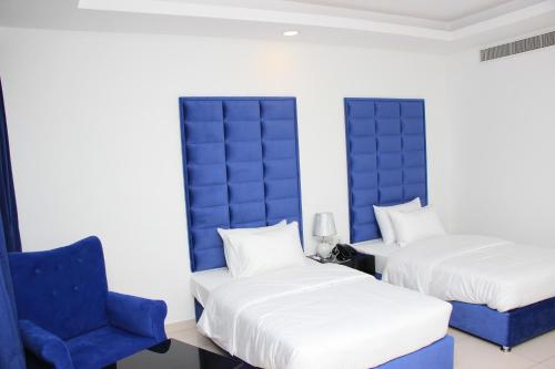 Cama o camas de una habitación en Parkside Plaza Muscat