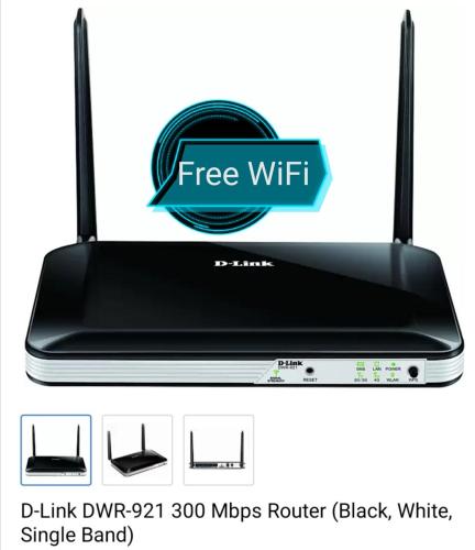a black router with a sign that reads free wifi at Abhi Homestay Hampi in Hampi