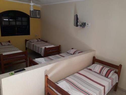 Cama o camas de una habitación en Suítes Vila Maresias