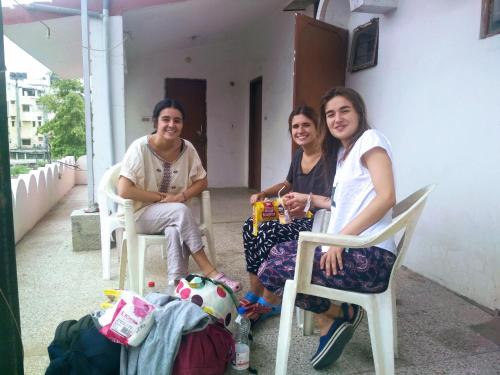 a group of three women sitting in chairs at Jwala Niketan Guesthouse Private rooms in Jaipur