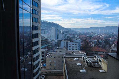a view of a city from a building at Bright, modern & cozy apartment in Tuzla
