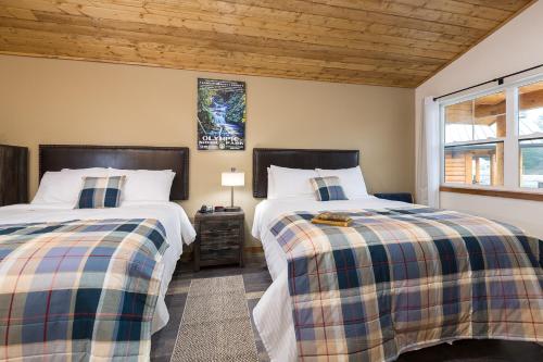 Ένα ή περισσότερα κρεβάτια σε δωμάτιο στο Woodland Inns