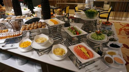 a buffet with different types of food on a table at Al Kout Beach Hotel in Kuwait