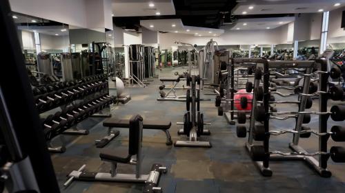 a gym filled with lots of machines at Al Kout Beach Hotel in Kuwait