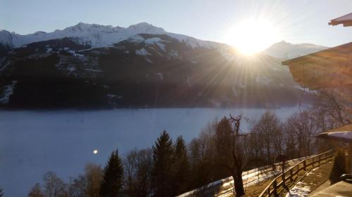 a view of a lake with mountains in the background at Appartements Wallner in Uttendorf