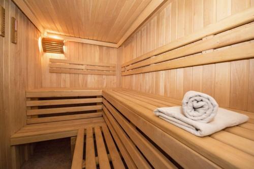 a wooden sauna with a towel sitting in it at Luxury Villa Kate - in Lucice Bay with turquoise sea, Amazing Seaviews, and Heated Pool in Milna