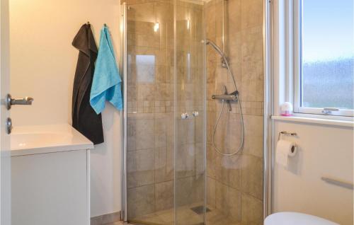a bathroom with a shower with a toilet and a sink at 2 Bedroom Stunning Home In Grindsted in Grindsted