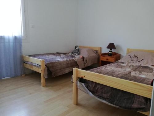 מיטה או מיטות בחדר ב-REZ DE VILLA SIX-FOURS