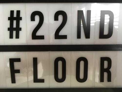 a close up of a sign with numbers on it at 22ndFloor Luxury Suite in Ostend