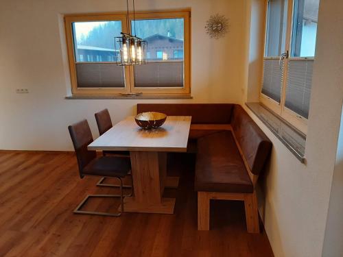 a dining room with a table and chairs and a window at Apart Alexandra in Strass im Zillertal