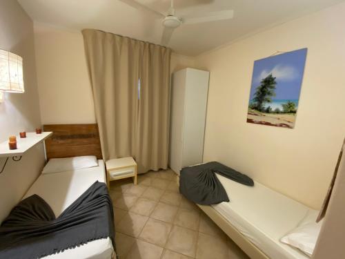 Ένα ή περισσότερα κρεβάτια σε δωμάτιο στο Zen House Tropical
