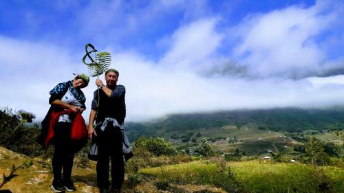 two people standing on top of a mountain at Surelee Homestay in Sa Pa