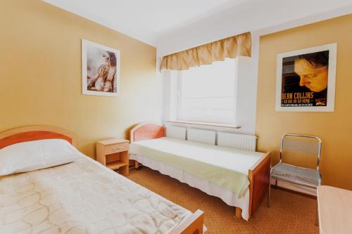 En eller flere senge i et værelse på Pensione Antonio
