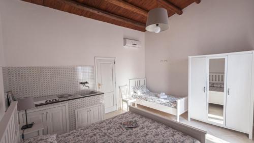 Ένα ή περισσότερα κρεβάτια σε δωμάτιο στο Villa Calò