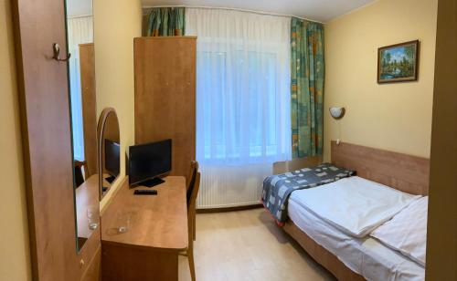Postel nebo postele na pokoji v ubytování Zajazd Saga