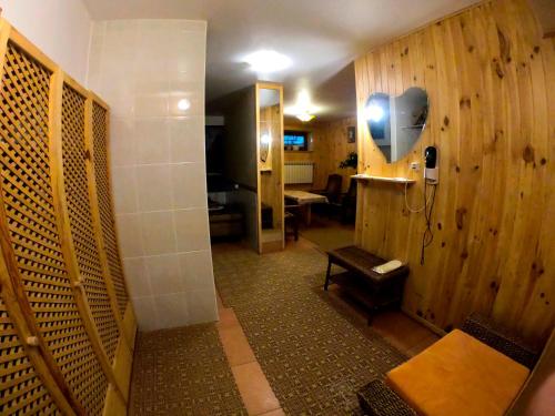 a room with a bathroom with a bench in it at Hotel Lavilia in Kyiv