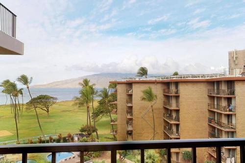 a view of the ocean from a balcony of a building at Oceanfront penthouse with amazing views at Kauhale Makai in Kihei
