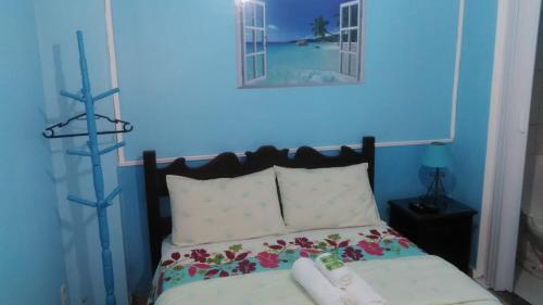 En eller flere senge i et værelse på Pousada Luar e Serenata