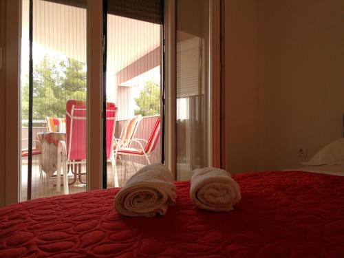 A bed or beds in a room at Apartments Vodice