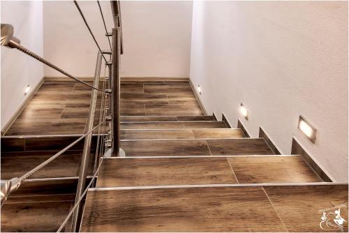 a staircase with wooden flooring in a room at Chata Harmónia Hrabovo in Ružomberok