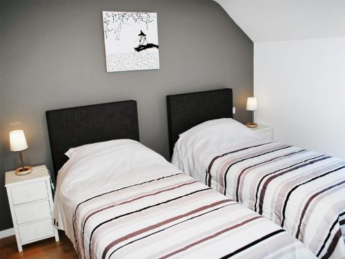 Llit o llits en una habitació de B&B Le Clos du Lac