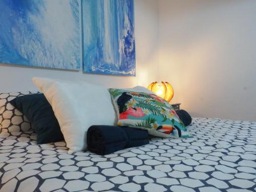 a bedroom with a bed with two pillows on it at The Portuguese Element in Faro