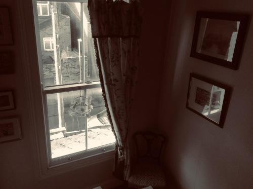 a window in a room with a view of a city at Abbey and Esk Bed and Breakfast in Whitby