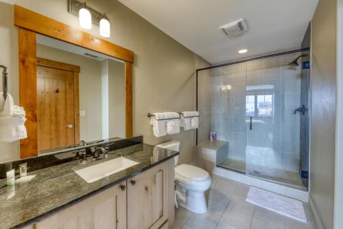 a bathroom with a shower and a sink and a toilet at Luxury Ski Hill Condos in Breckenridge