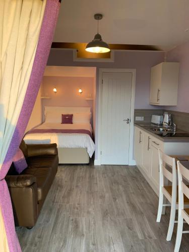 Ένα ή περισσότερα κρεβάτια σε δωμάτιο στο Hebridean Holiday Cabins