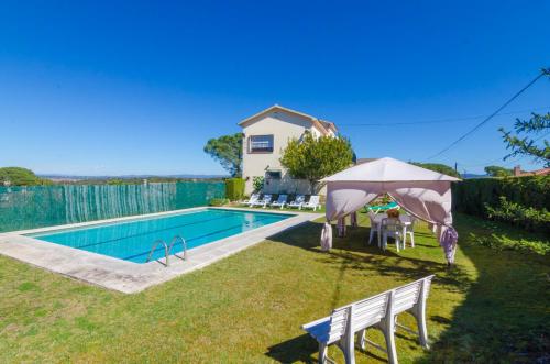 a villa with a swimming pool and a house at Club Villamar - Aygo in Maçanet de la Selva