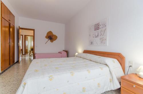 a bedroom with a large bed in a room at Club Villamar - Aygo in Maçanet de la Selva