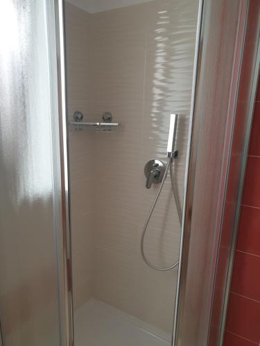a shower with a glass door in a bathroom at Casa del Sole - Avola in Avola