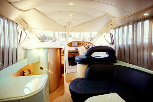 a bus with two seats in the back of it at Porto Private Yacht- Accommodation Douro River in Porto