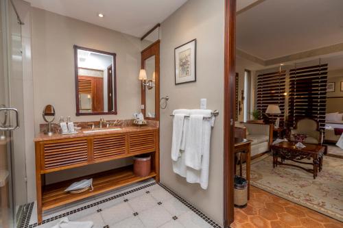a bathroom with a sink and a mirror at Mansion Alcazar in Cuenca