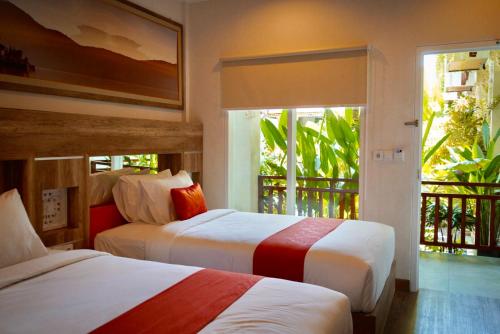 Tempat tidur dalam kamar di The Nyaman Bali